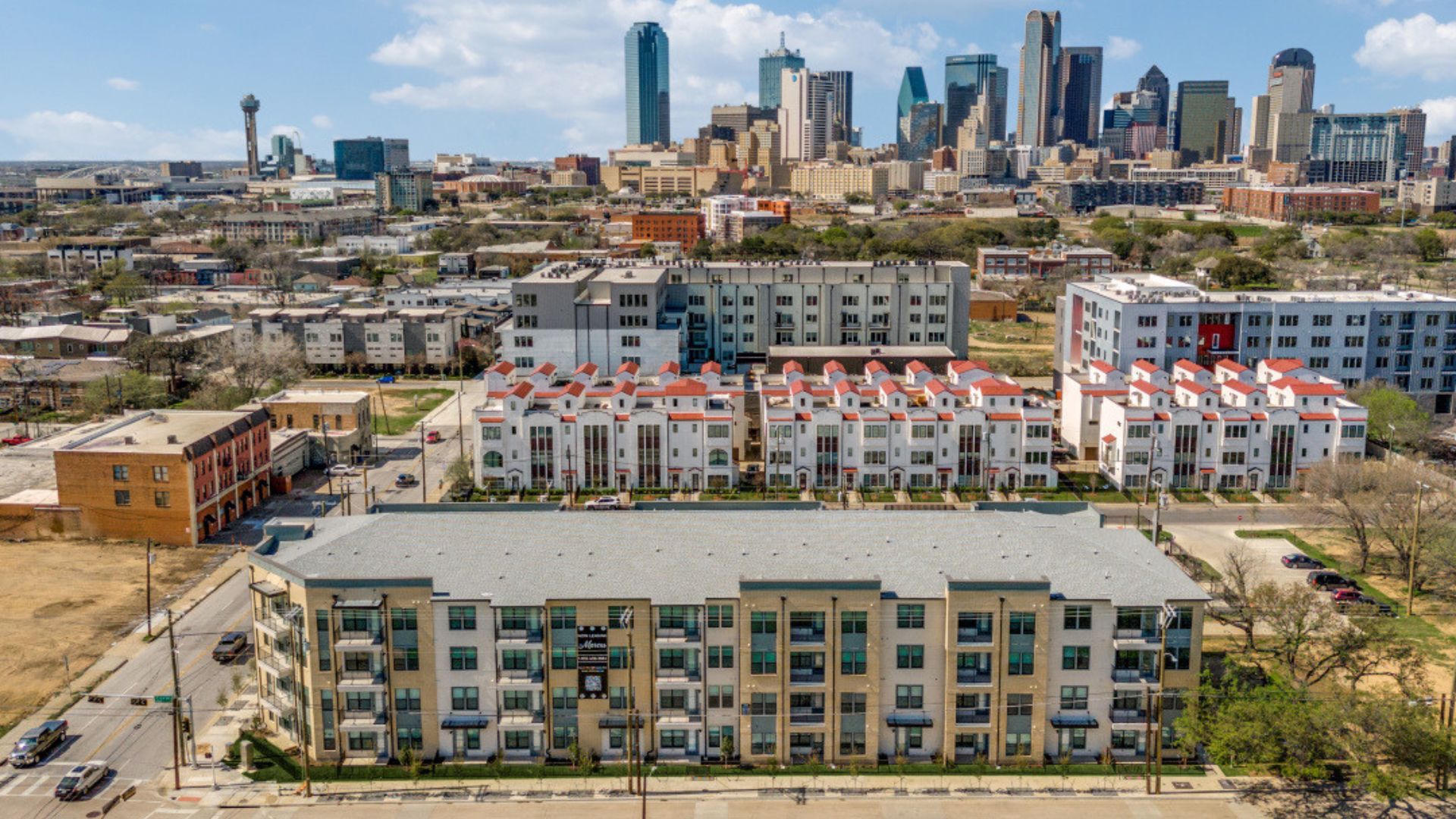 The Marcus at 2020 S Ervay St — exterior view of the four-story residential building in the Cedars, South Dallas