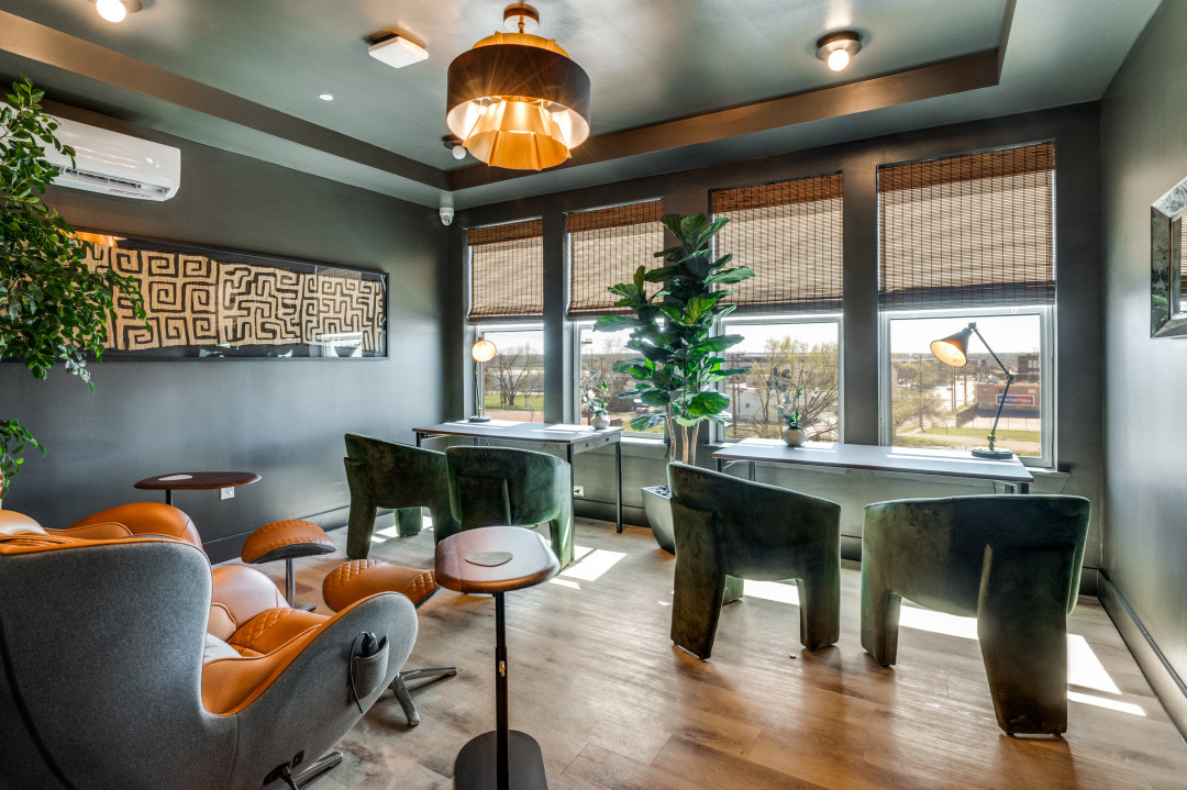 The Marcus tenant lounge — soft seating and co-working tables for residents